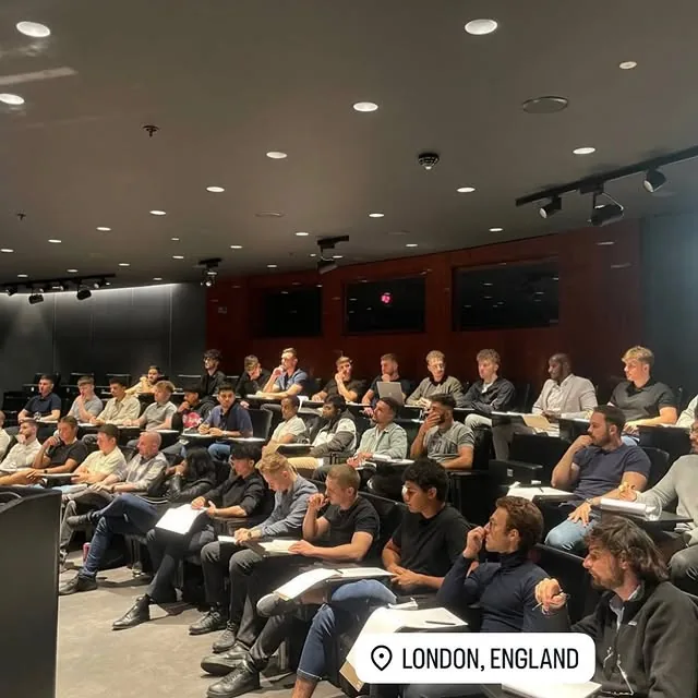 Members in a London lecture hall